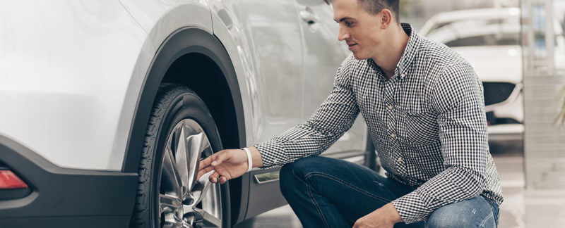 Man checking the air on his tires