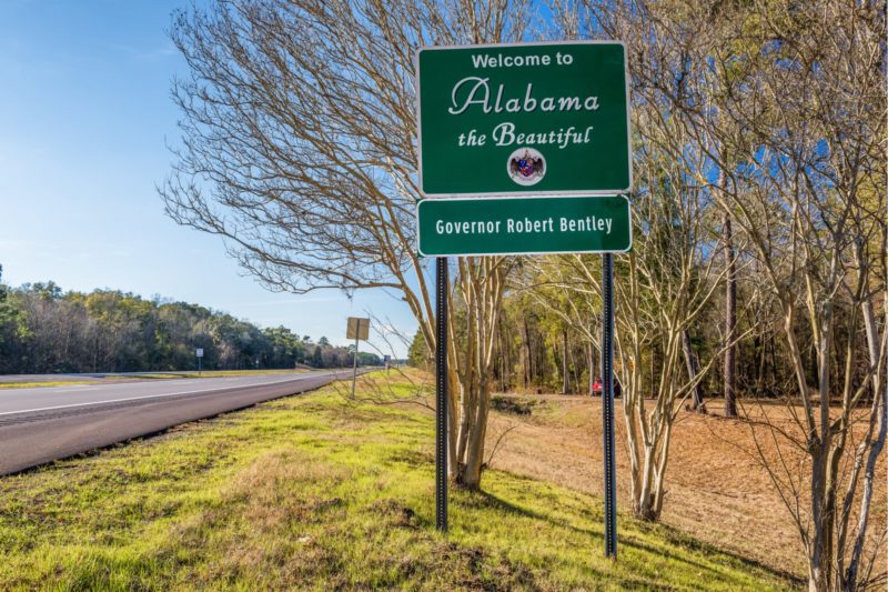 Road sign the says welcome to Alabama the beautiful governor Robert Bentley