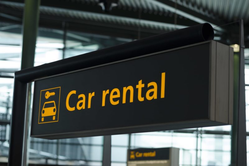 Sign in airport that says car rental