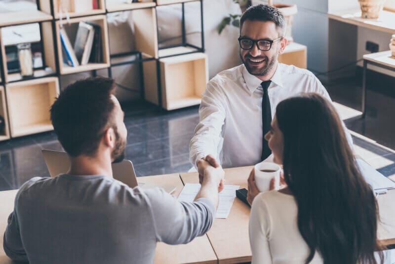 insurance agent providing coverage to customers in an office