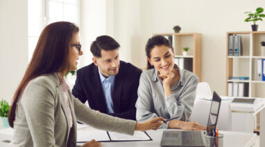 couple with car insurance agent