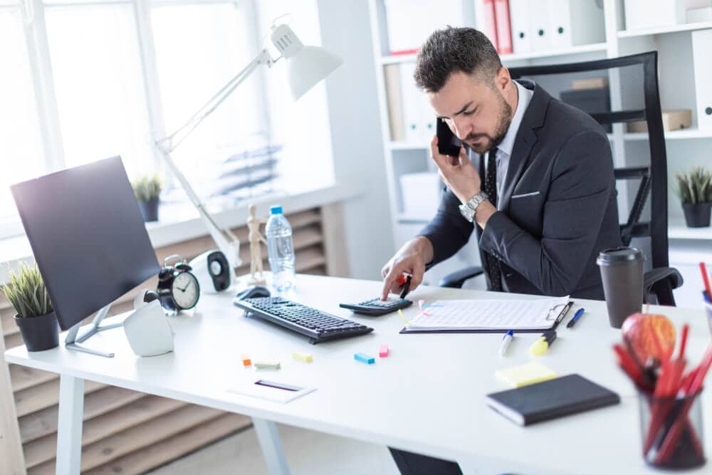 insurance agent on the phone with client