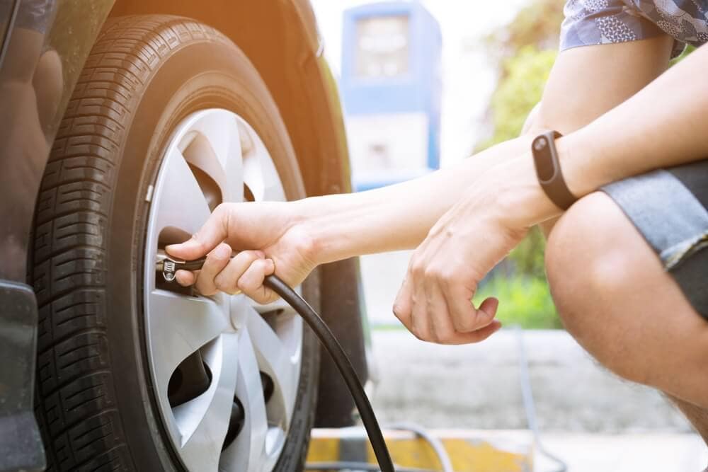 man airing up tires