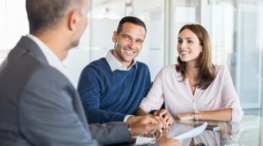 couple working with insurance agent