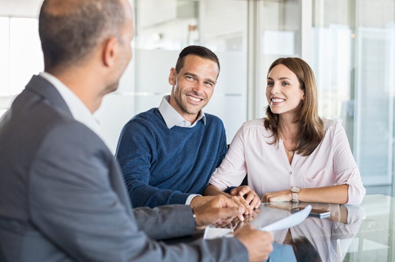 couple working with insurance agent