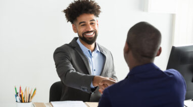 independent insurance agent shaking hands with client