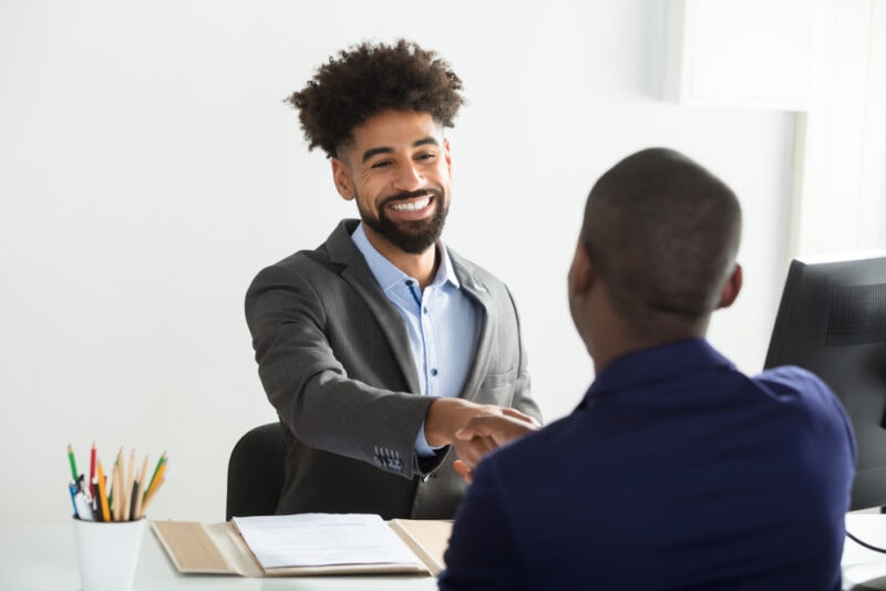 independent insurance agent shaking hands with client