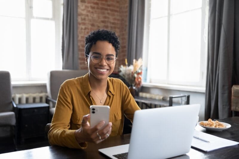 Professional insurance sales agent in front of laptop