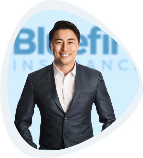 Smiling Asian businessman in front of Bluefire sign.