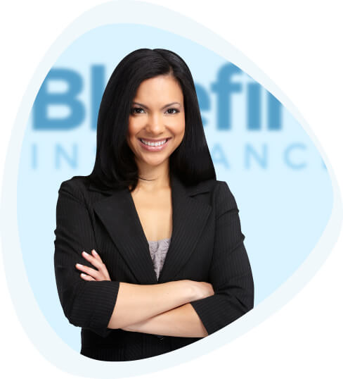 Smiling young businesswoman with arms crossed standing in front of Bluefire sign.
